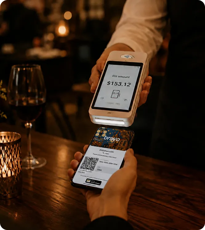 Bravo gift card protected by a shield over a dinner table